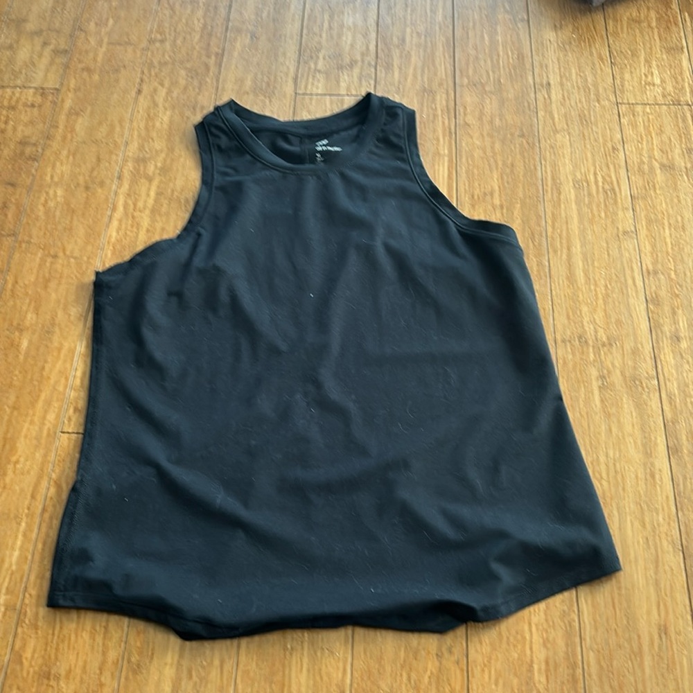 This is a black all in motion medium tank top